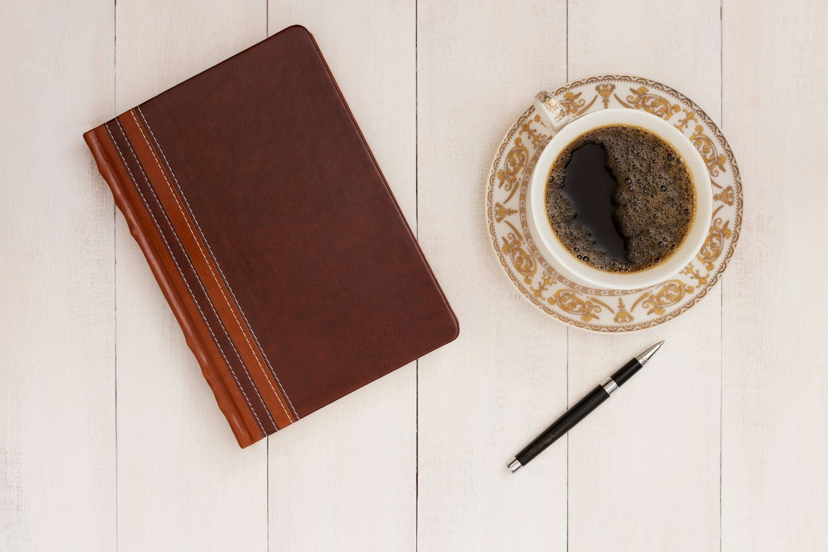 Notebook and coffee for reviewing capsule excipient labels